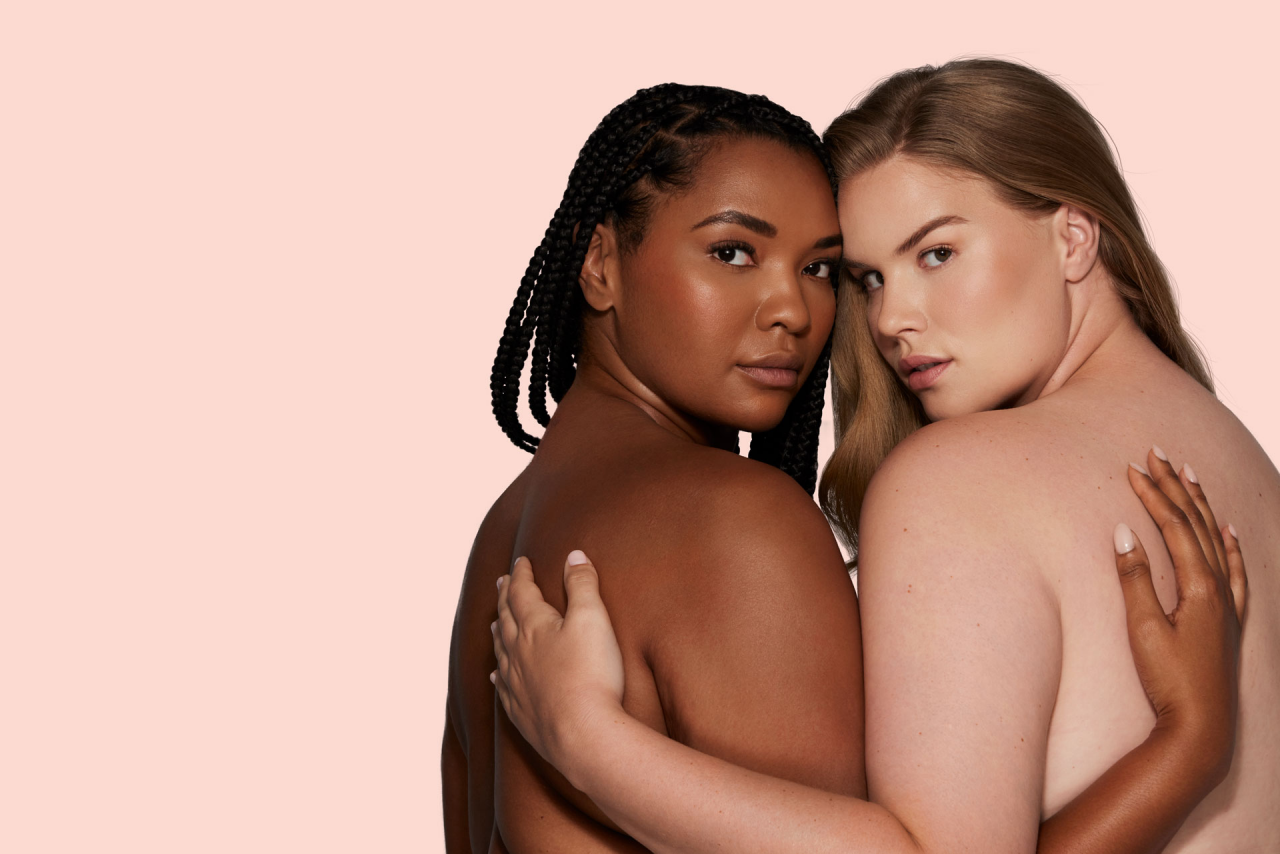 Two women hugging with smooth skin features
